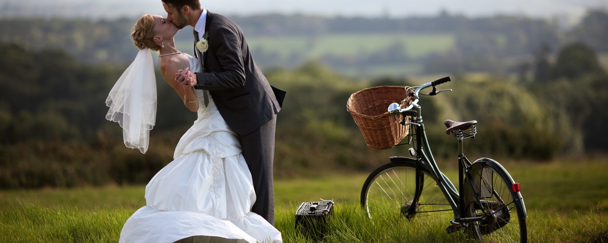 Weddings - Romantic Scene Bride & Groom Kissing.